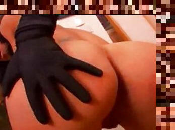 Hottie in black gloves toys her ass