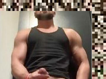 Jerking off while flexing muscles