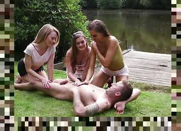 Sexy nude beauties share cock by the lake in hot CFNM play