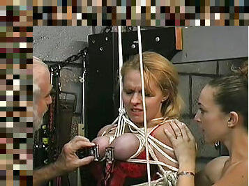 Busty babe with bondage in her tits being tortured