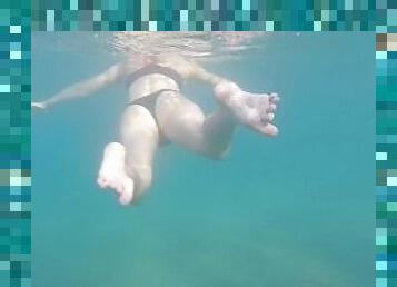 Aquatica's feet melted in the blue sea