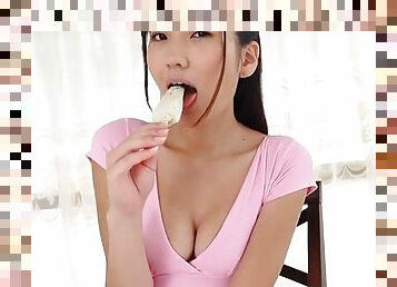 Ice cream eating Japanese girl has great cleavage
