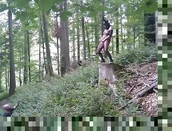 Standing pissing in a woods in a bunny mask and fishnet