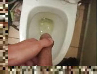 circumcised dick pissing in the toilet