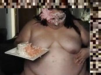 Fat pig devours sweet cake