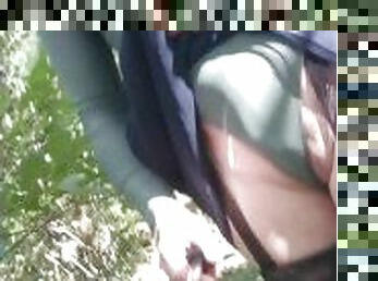 CD tranny lifting her skirt while out for a walk