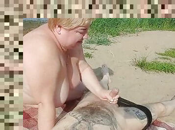 sucking cock and jerking off on a public beach