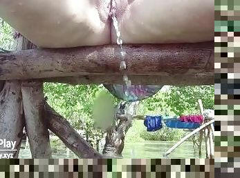 Chubby shaved pussy peeing outdoors